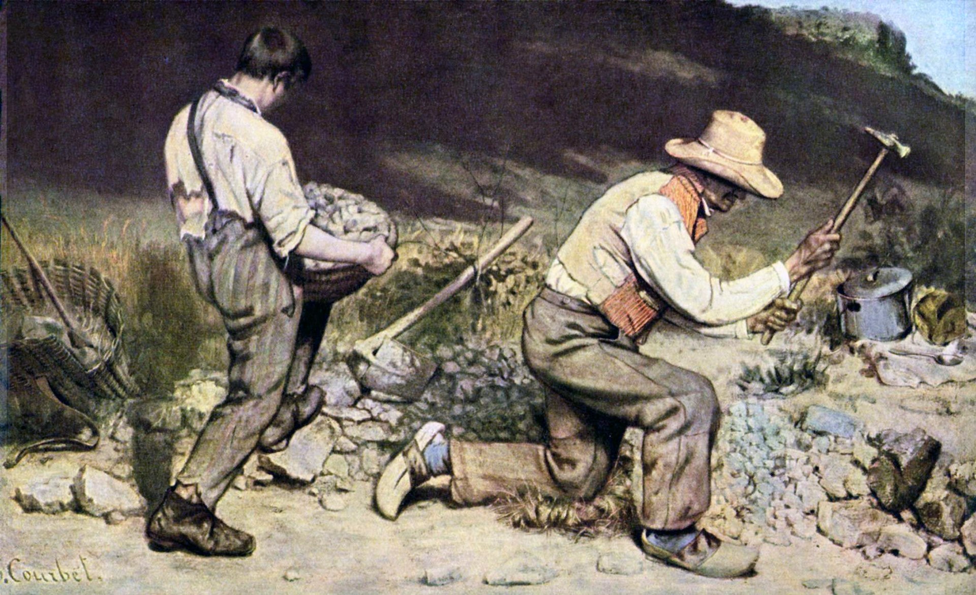 a man breaks rocks while a young boy in oversized rags hauls baskets of gravel